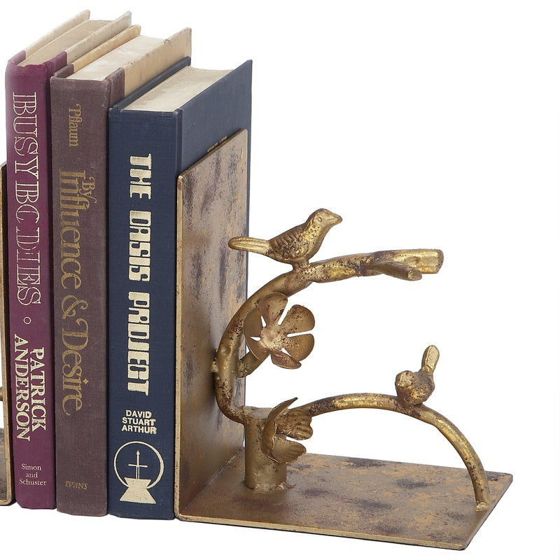 Antique gold nesting bird bookends, two-piece set with curved metal bases.