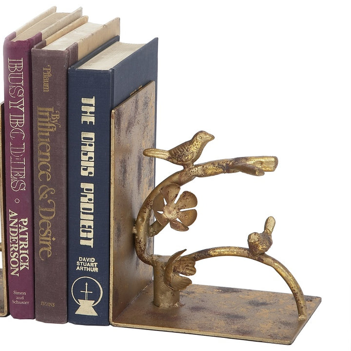 Antique gold nesting bird bookends, two-piece set with curved metal bases.