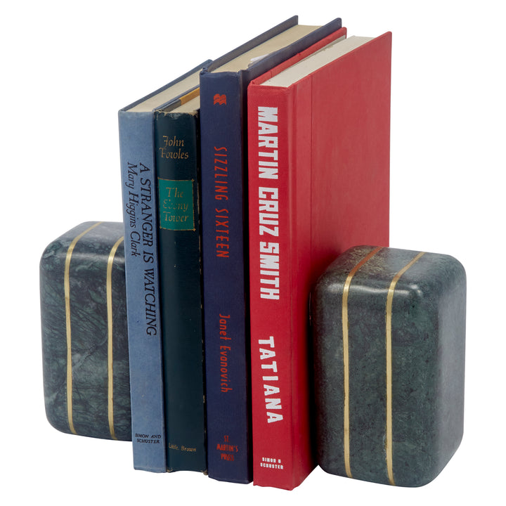 Green marble bookend pair with brass inlay stripes, holding upright hardcover books