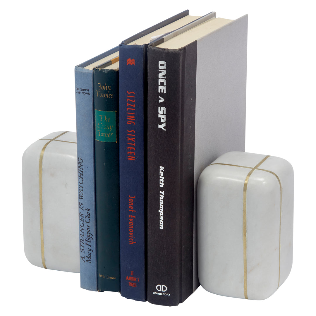 White marble bookends with brass inlay, rectangular book supports holding books