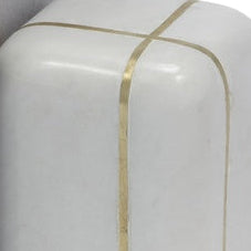 Four books standing upright between two white marble bookends with gold bands, photographed on a clean white background.