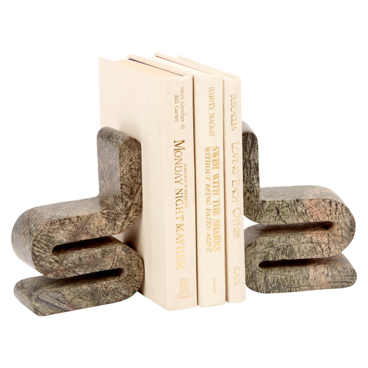 Curved stone-look bookends holding a row of books, side clamp style
