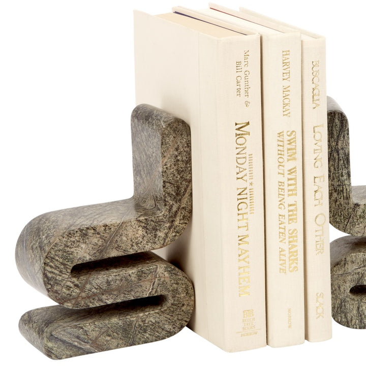 Curved stone-look bookends with open book support, three-book view