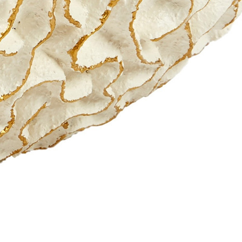 White oval bowl with gold swirl pattern along the rim edge