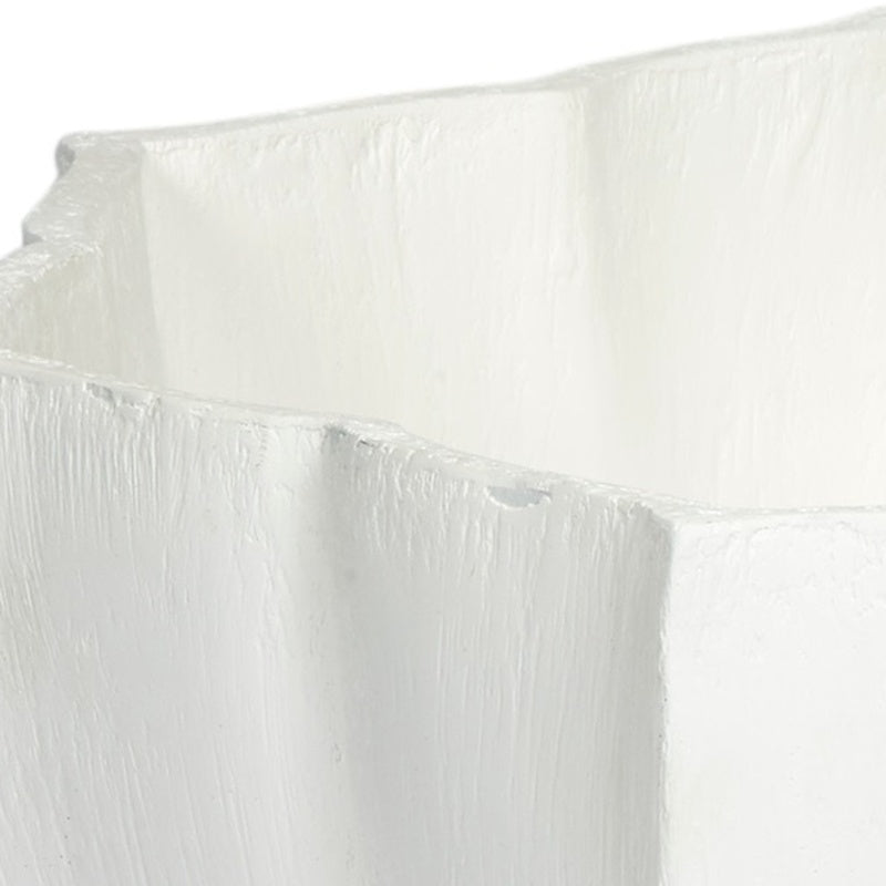 White decorative bowl rim and side with raised ridges and gesso texture