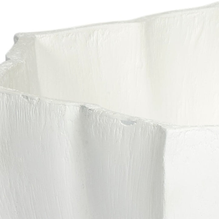 White decorative bowl rim and side with raised ridges and gesso texture