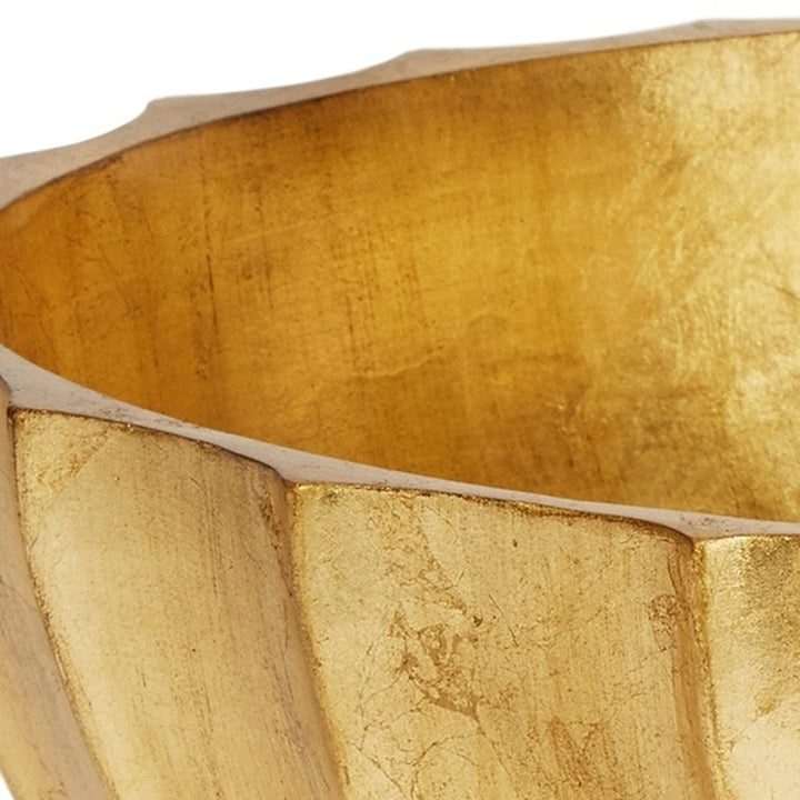 Gold leaf decorative bowl close-up of textured side panels and raised rim