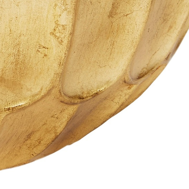 Gold leaf decorative bowl close-up of curved side with hammered texture
