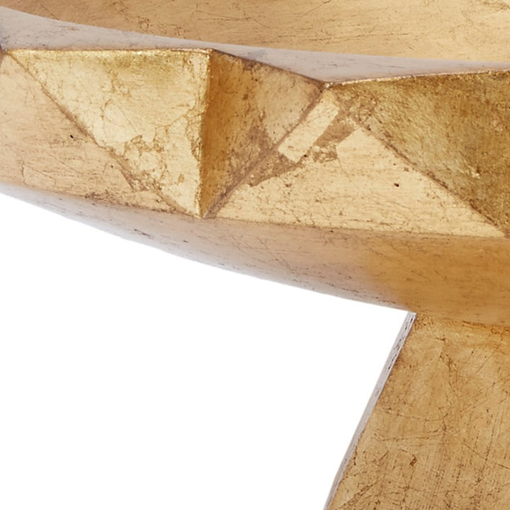Gold leaf decorative bowl rim with faceted geometric pattern close-up