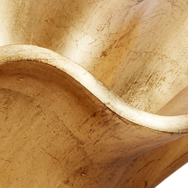 Gold leaf decorative bowl rim detail with curved white-gold edge