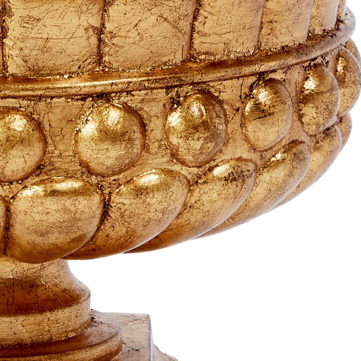 Gold leaf pedestal bowl detail with raised round bumps and cracked texture