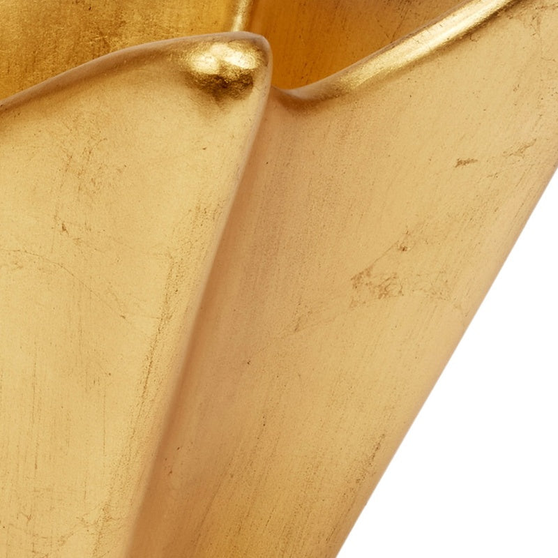 Gold leaf decorative bowl corner close-up with glossy rim and seam