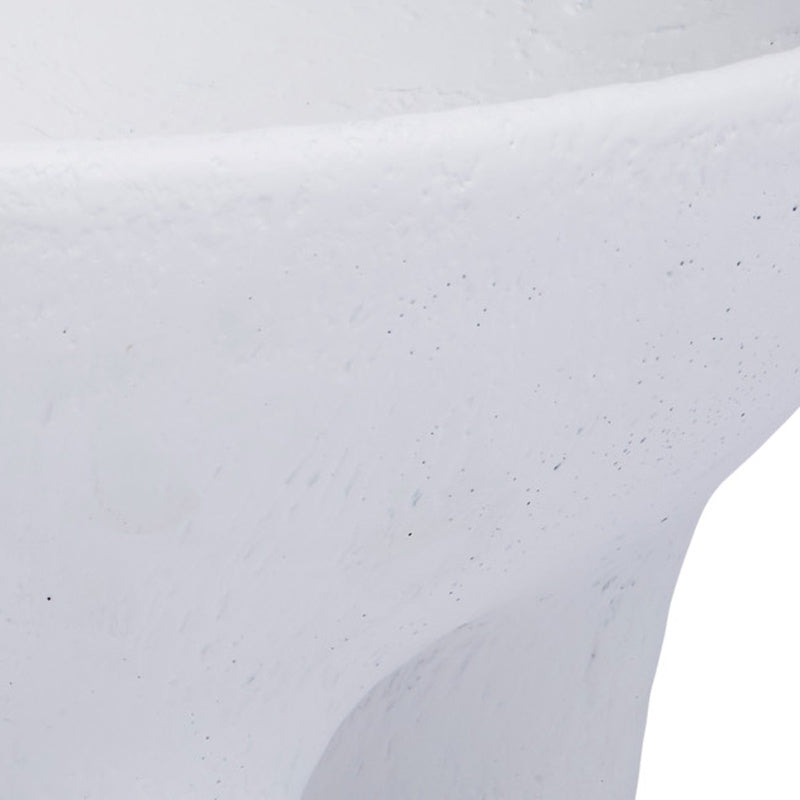 White gesso bowl close-up of smooth curved edge with speckled texture