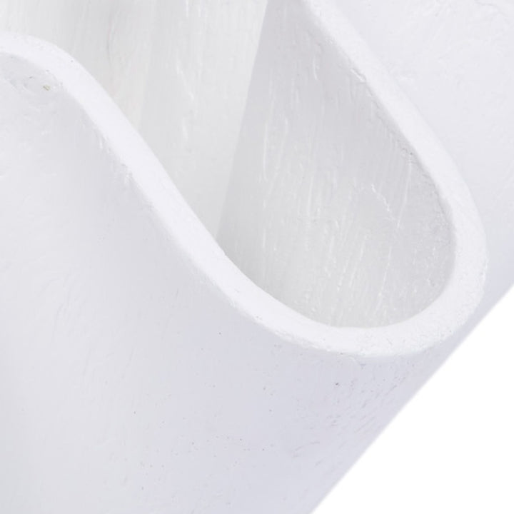 White decorative bowl detail showing curved open channel and textured finish
