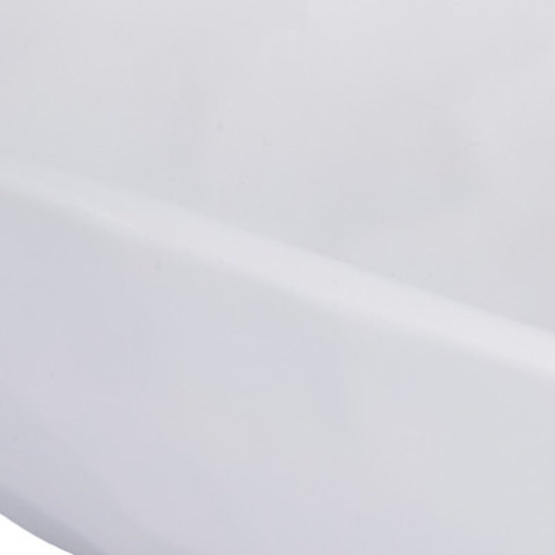 Close-up of white gesso decorative bowl surface, smooth matte texture