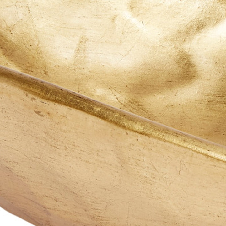 Gold decorative bowl rim close-up with hammered texture and subtle brushed finish