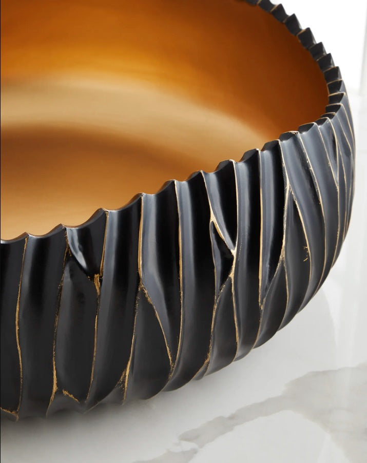 Sophisticated Dana black bowl with gold detailing, adding a luxurious and stylish touch to any room.