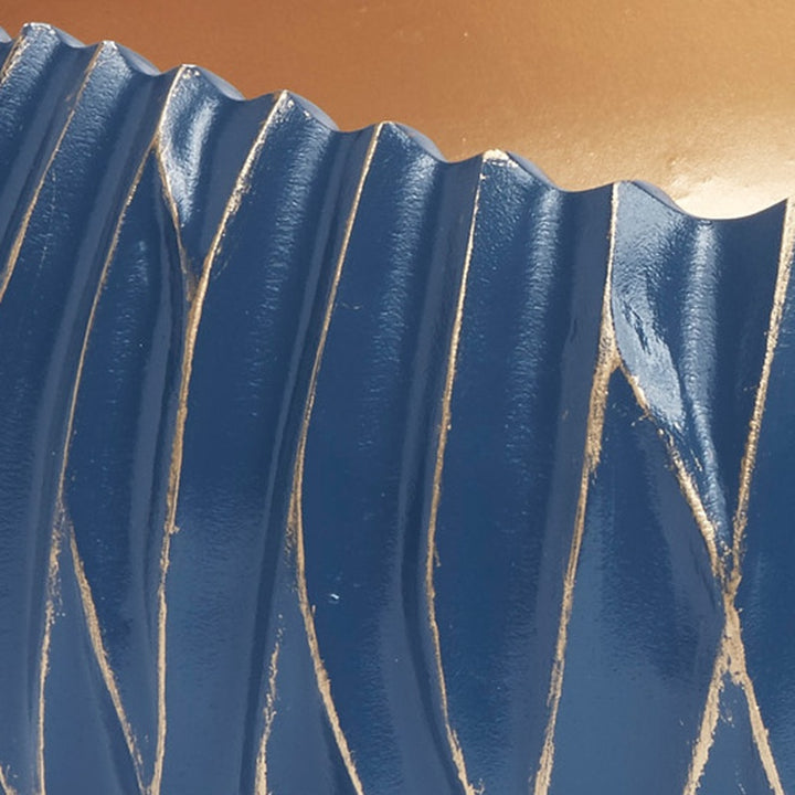 Blue decorative bowl with vertical ridges and gold accent lines