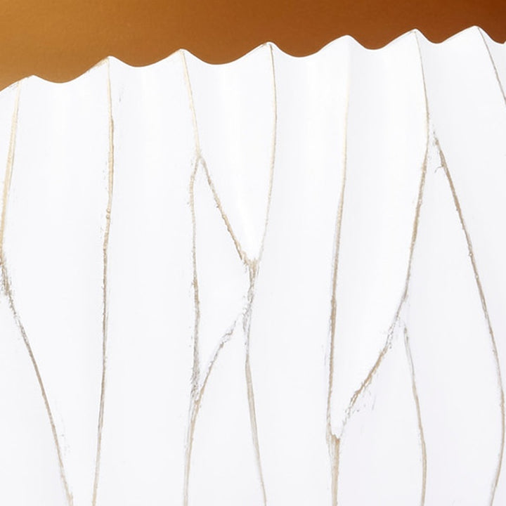 White decorative bowl with scalloped top edge and gold-accented ridged texture