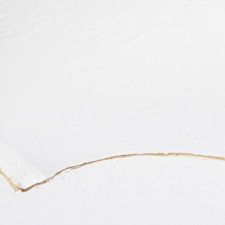 White gesso bowl with gold-trimmed rim edge