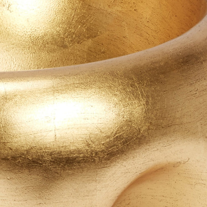 Gold leaf decorative bowl interior, close-up shimmering gold leaf finish