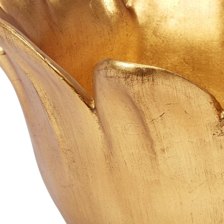 Close-up of gold decorative bowl rim and textured gold leaf surface, matte-sheen