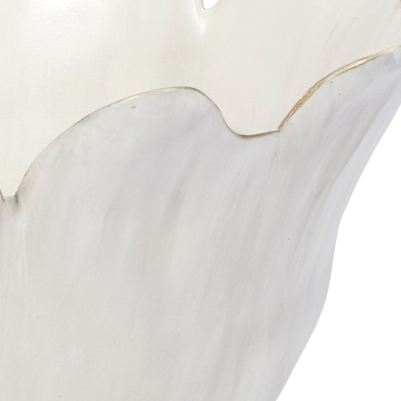 Cream decorative bowl close-up with ruffled rim shape and gold outline accents