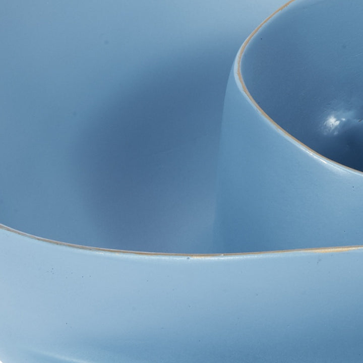 Small blue bowl interior with smooth rim and glossy finish