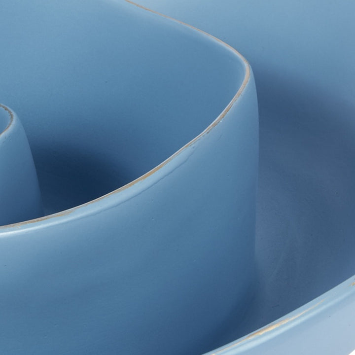 Small blue decorative bowl with curved sidewall and glossy rim trim