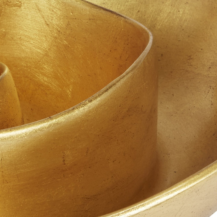 Gold leaf decorative bowl corner with smooth inner curve and brushed shine