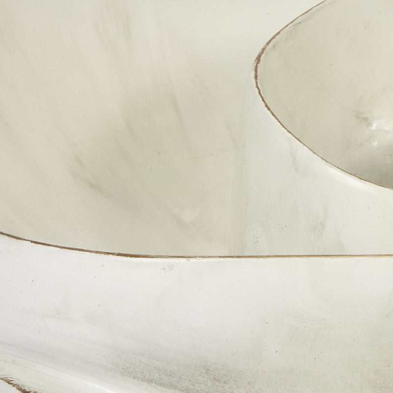 Close-up of cream bowl interior with thin gold swirl line along the rim