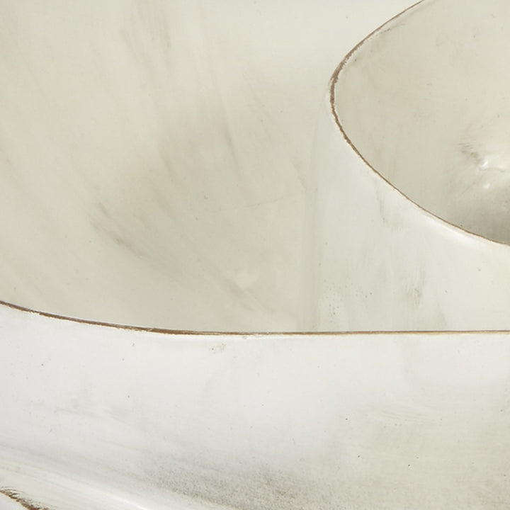 Close-up of cream bowl interior with thin gold swirl line along the rim