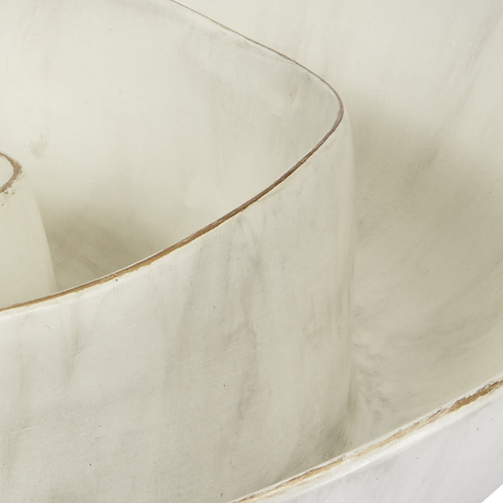 Close-up of cream bowl side with thin gold edge and subtle swirl texture