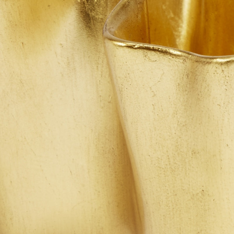Gold leaf bowl close-up of hammered gold surface and curved rim edge