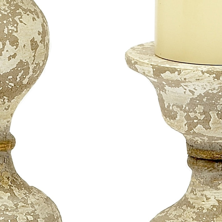 Gold-toned candle stick top with speckled texture and candle cup opening