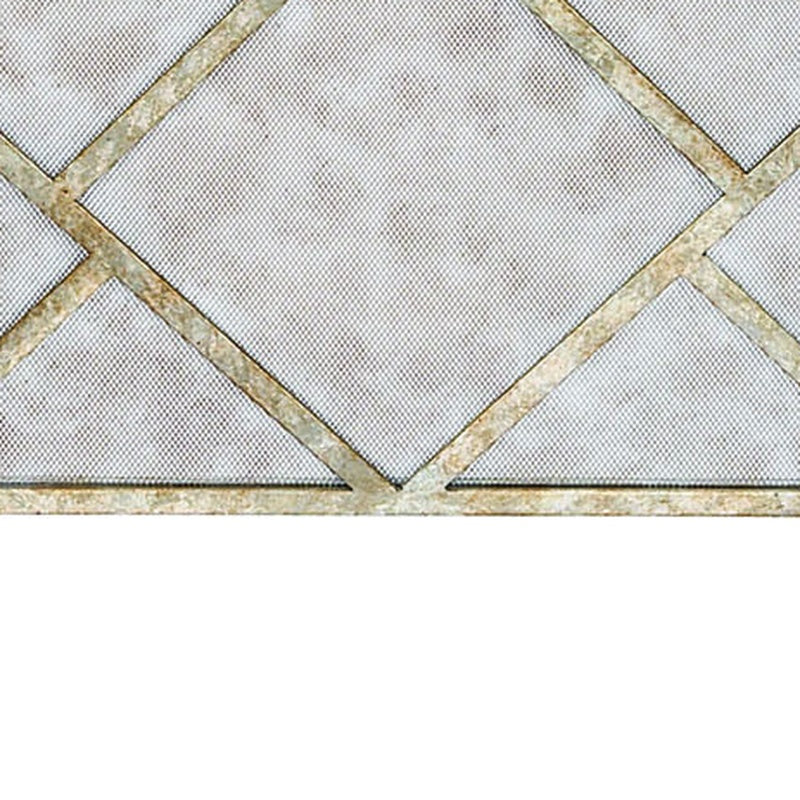Geometric fireplace screen with gold geometric frame and diamond mesh center