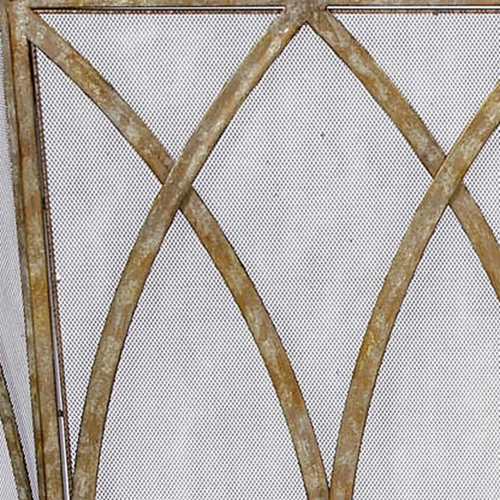 Champagne gold fireplace screen with crisscross metal frame and mesh panel