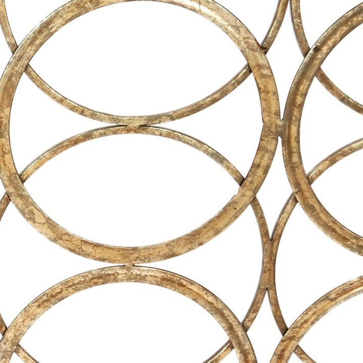 Geometric fireplace screen with gold circular ring pattern