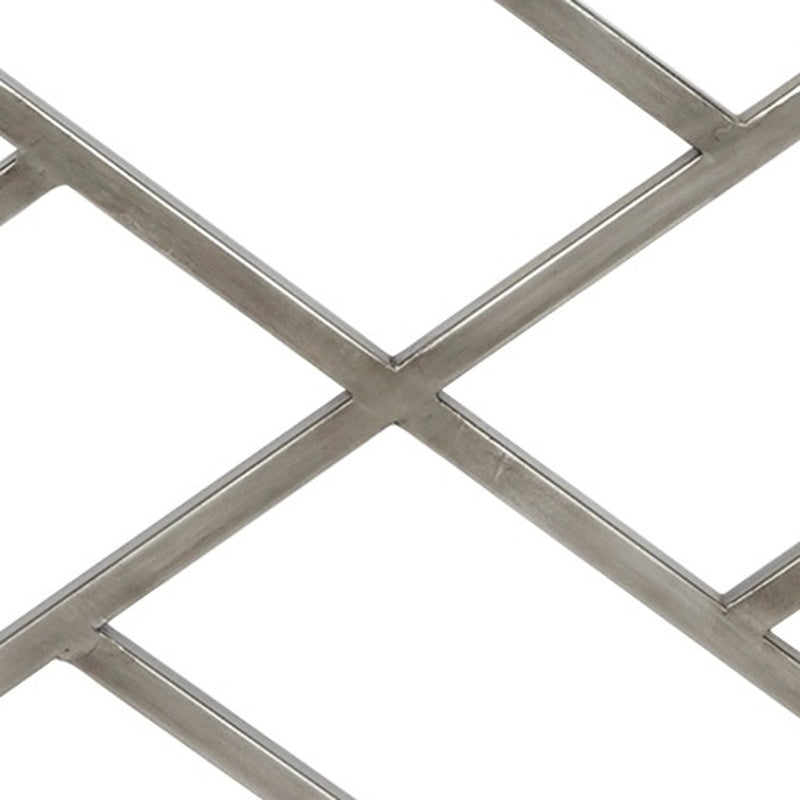 Silver metal fireplace screen close-up of X-cross bar and diamond grid sections