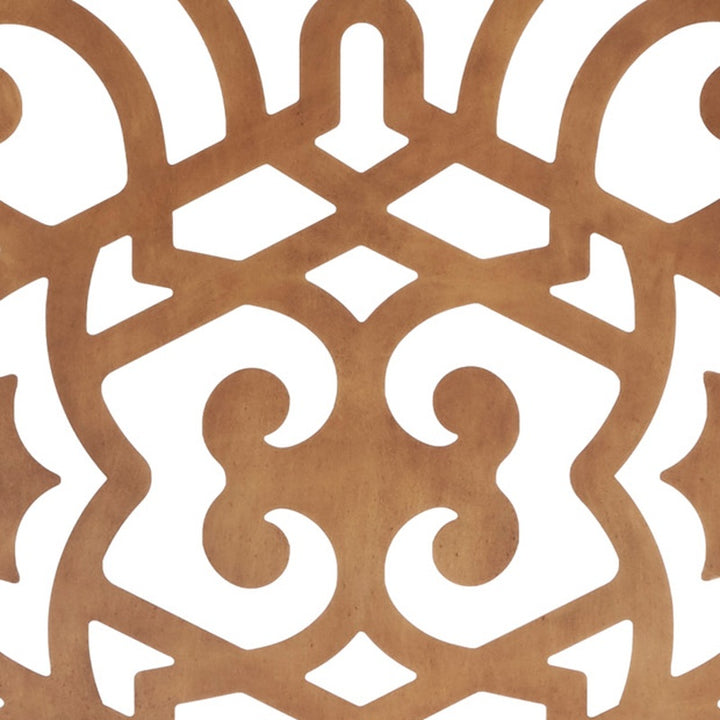 Decorative dark gold fireplace screen with scroll-like medallion and cutouts