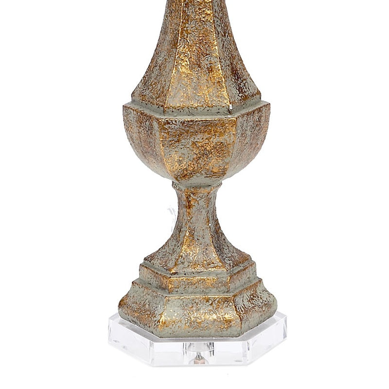 Aged gold lucite lamp base with finial and beige linen drum shade
