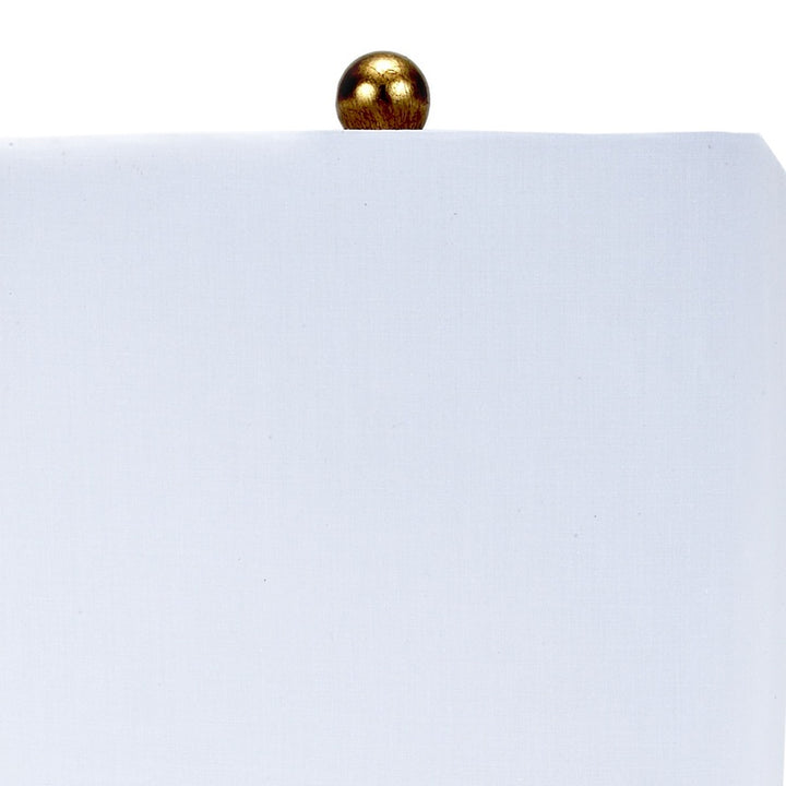 Square white lamp shade with gold finial on lucite base post
