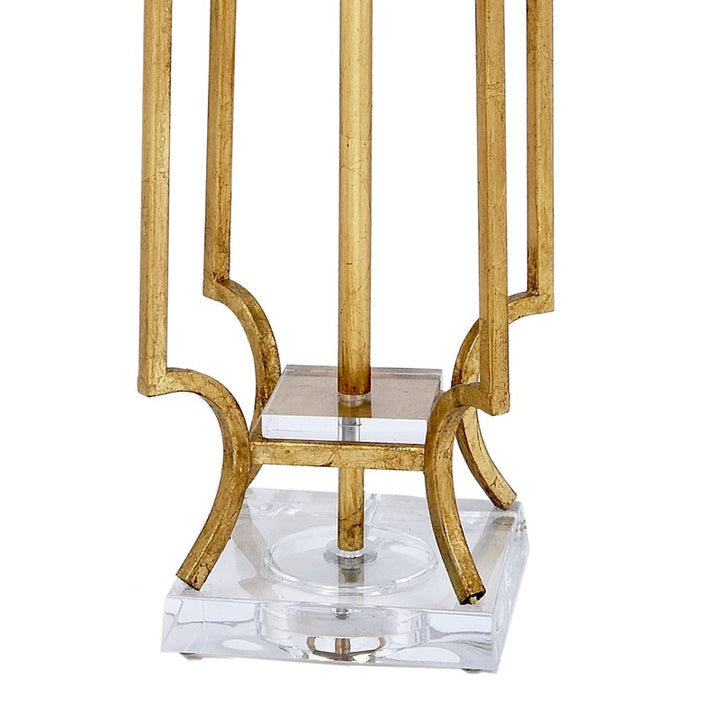 Clear lucite lamp base with gold scroll-style legs and acrylic center support