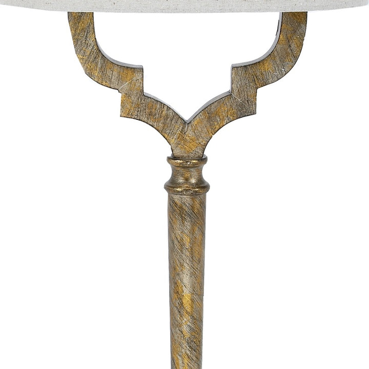 Champagne gold quetrefoil-style base and stem with oval linen shade edge