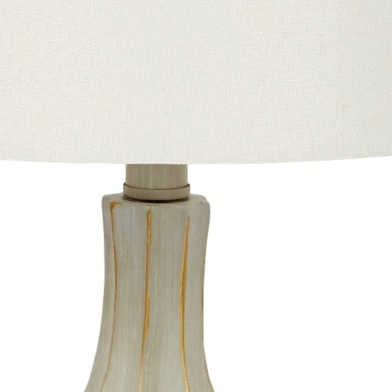 Table lamp base in light gray cement with gold vertical stripe detail