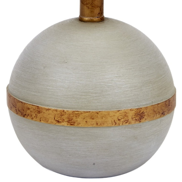 Sphere table lamp base with beige fabric top and gold band accent