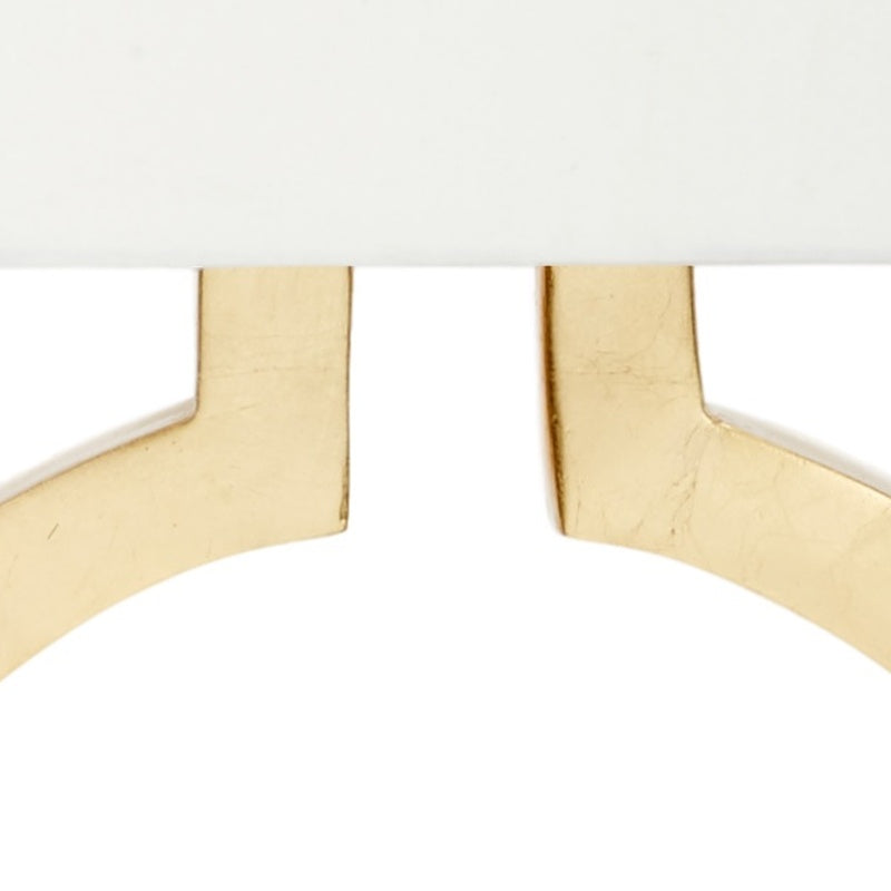 Gold leaf lamp support arms under cream shade
