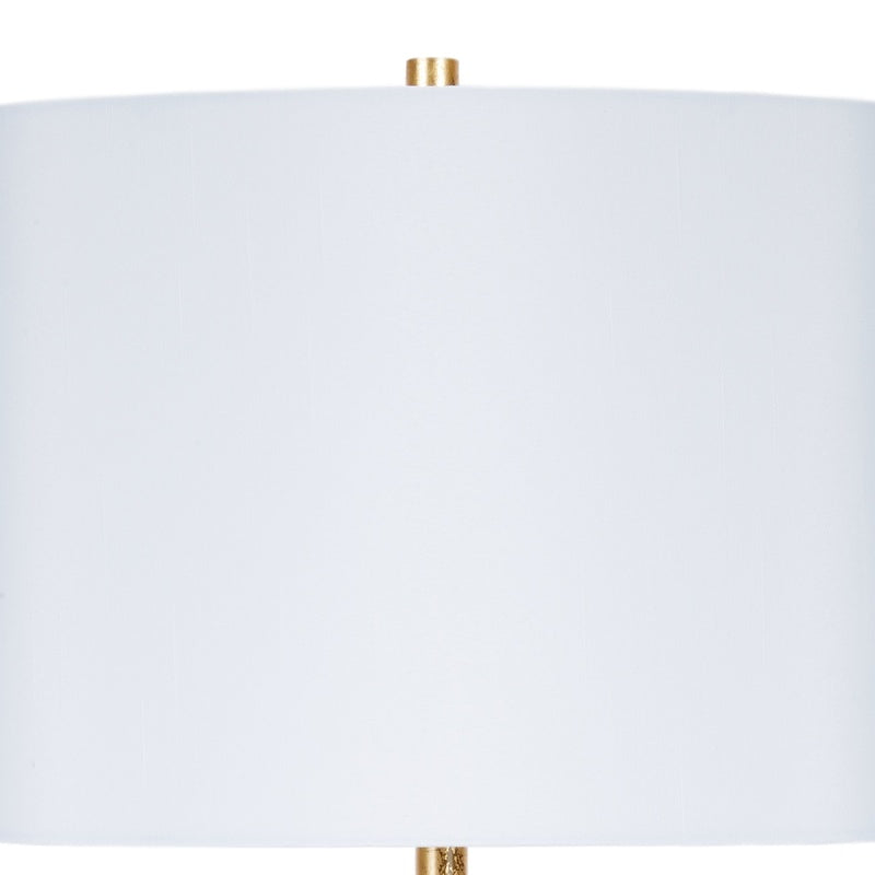 White oval lamp shade with gold finial and central pole