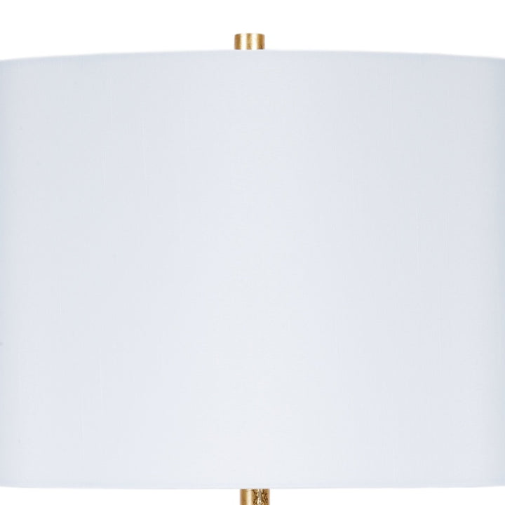 White oval lamp shade with gold finial and central pole