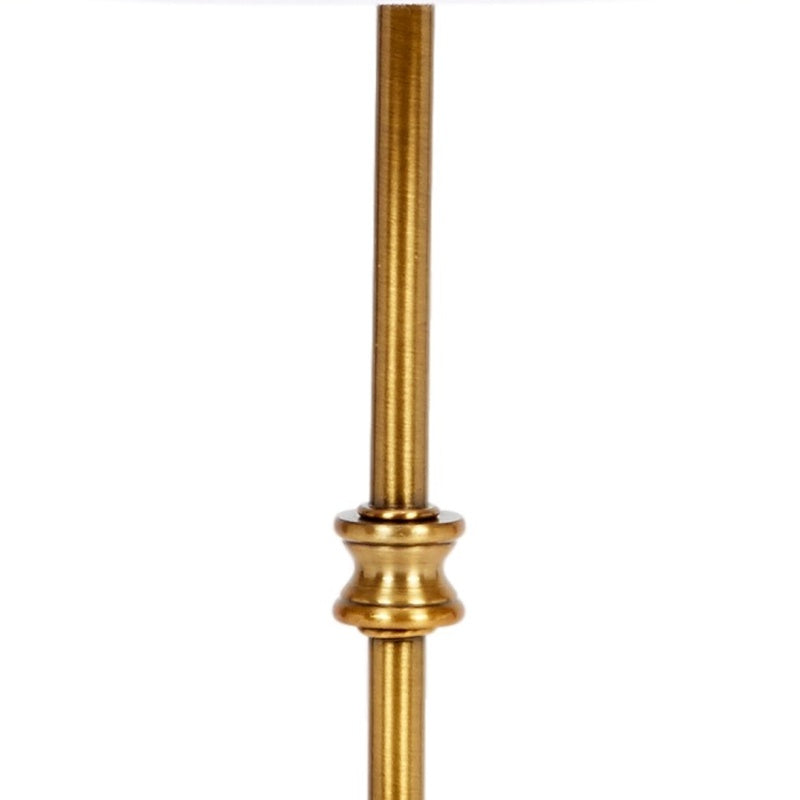 Gold lamp post with ornate ring details, with white bulb base segment